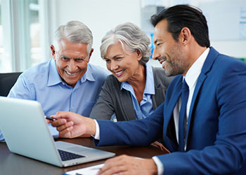 Senior couples preparing estate plan with attorney
