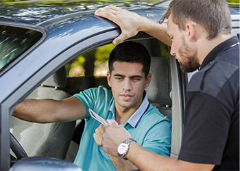 Police officer checking driver license