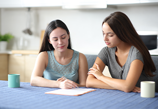 Serious interracial couple signing contract