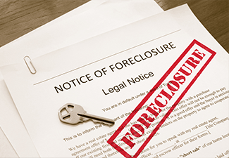 Home foreclosure legal document with house key