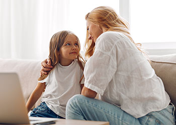 Mother with her little daughter in home
