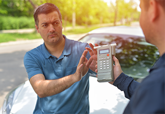 Driver due to being subject to test for alcohol content with use of breathalyzer