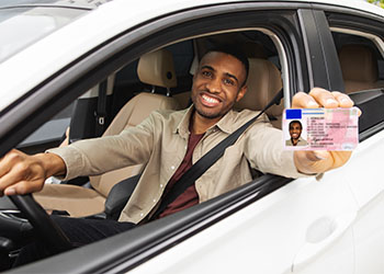 Man showing his license