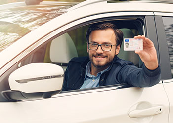 Man showing with driver license