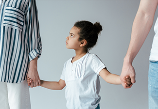 Kid holding hands with divorced foster parents isolated on grey