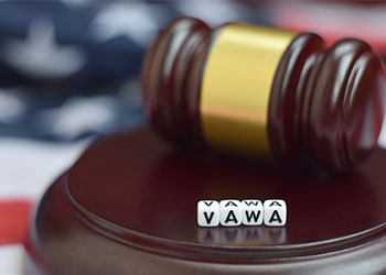 VAWA word in cubes with gavel and flag of USA