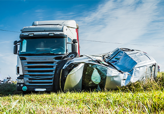 Car accident on a road in September, car after a collision with a heavy truck