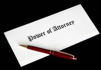 Power of Attorney document with pen on table