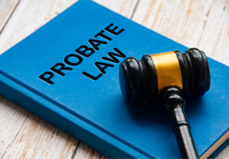 Probate law book with gavel on white background.