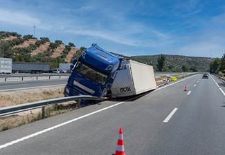 Truck with an accident refrigerated semi-trailer, overturned on road