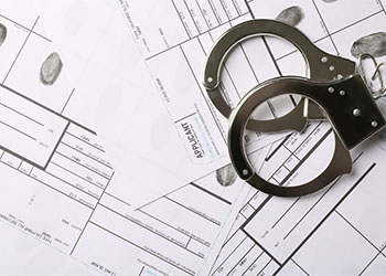 Handcuffs and fingerprint record sheets