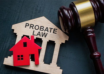 Probate law word in house model with gavel in table