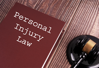 Personal Injury Law written on a book with judge gavel