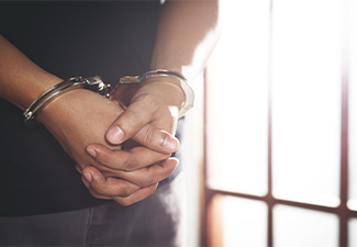 Person in handcuff arrested by the police