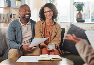 Financial advisor, meeting and mature couple on sofa for estate planning