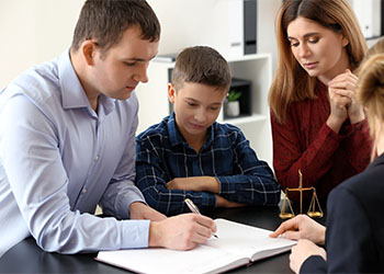 Parent with their child visiting attorney office