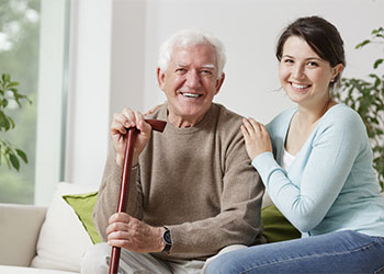 Smiling old man with his guardian