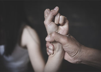 Man holding hand of women tightly
