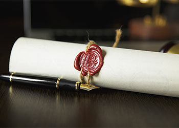 Notary stamp on will document with pen in table