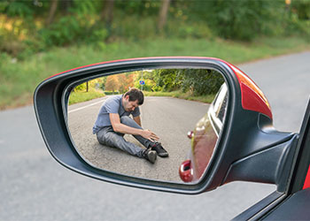 Injured man in rear view mirror