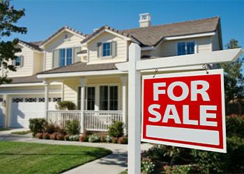 For Sale sign Infront of a home