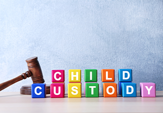 Court gavel and cubes with text CHILD CUSTODY on light background