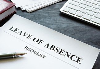 Leave of absence request on the table with pen