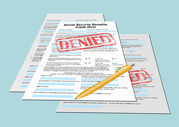 Denied stamp on a social security form
