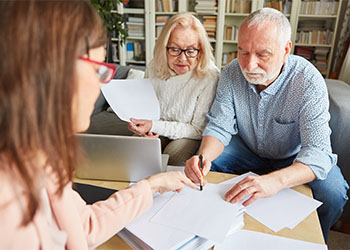 Old man review and signs advance directive papers