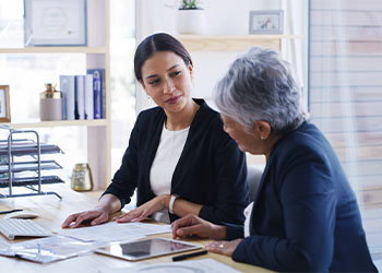 Senior women consulting with attorney for estate planning