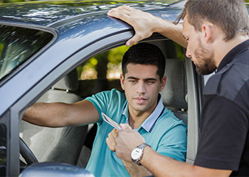 Man showing his driving license to police officer