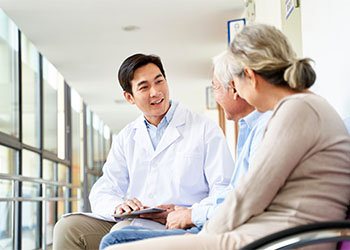 Doctor talking to senior patient