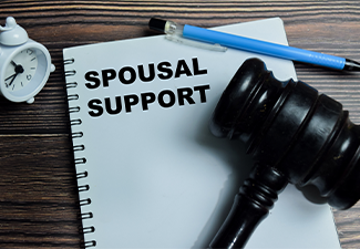 Concept of spousal support write on book isolated on Wooden Table