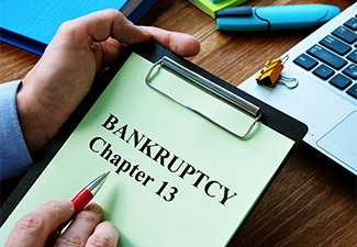 Man reads bankruptcy chapter 13 law in the office