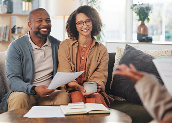 Couples discussing estate plan options with professional
