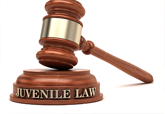 Juvenile law gavel on table