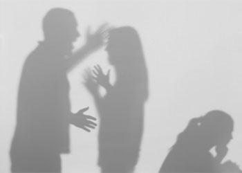 Silhouettes of quarreling parents and little child