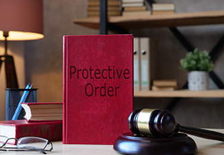 Protective Order is shown on the photo using the text and gavel on table