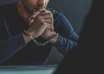 Serious man in handcuffs