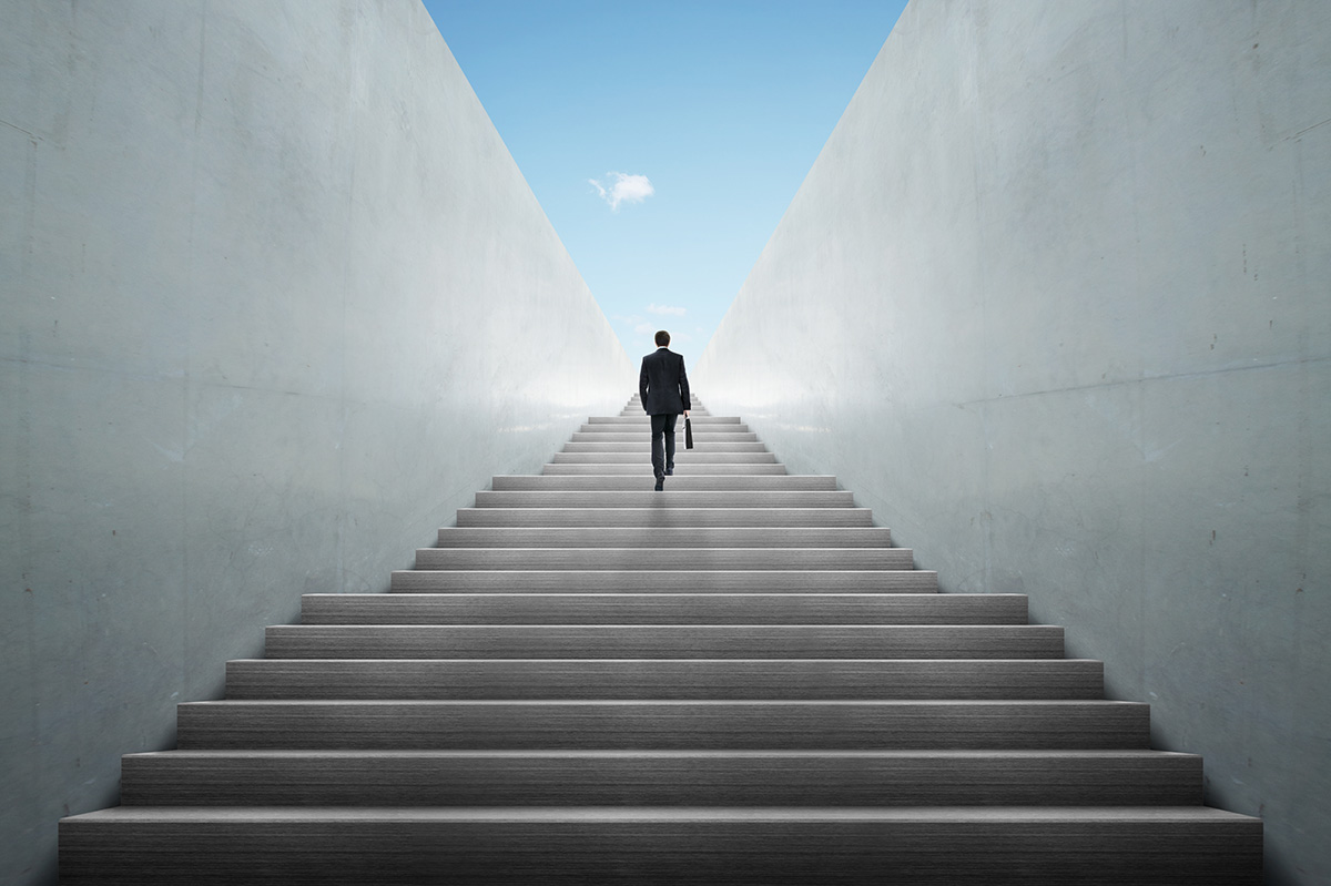 Man climbing up stair case