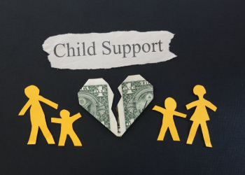 Paper family with torn dollar bill and child support note