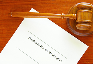 Bankruptcy filing form and gavel on the table