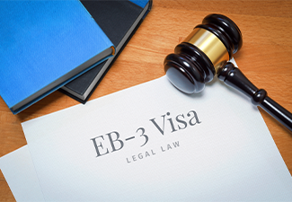 EB-3 Visa form desk with books and judges gavel in a lawyer's office