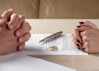 Wife and husband signing divorce documents