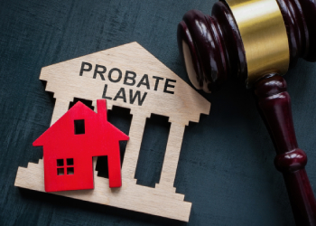 Probate Law words on model courthouse with tiny red house and gavel