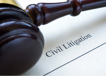 Close up of civil litigation document and gavel
