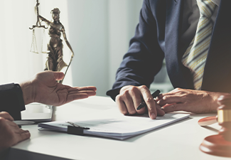 Businesswoman and lawyer discuss the contract document