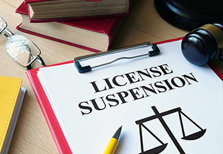 License Suspension is shown on paper with pencil and Gavel