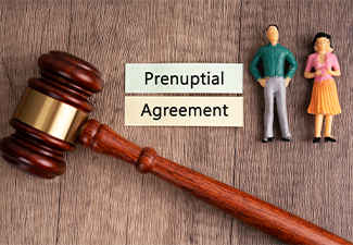 High angle view of gavel and text prenuptial agreement