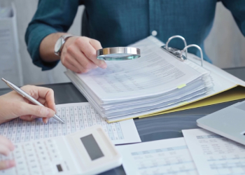 Auditor inspecting financial documents